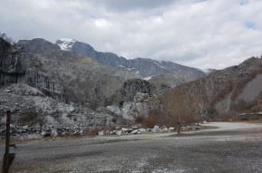 Rocky landscape with mountains in the background.