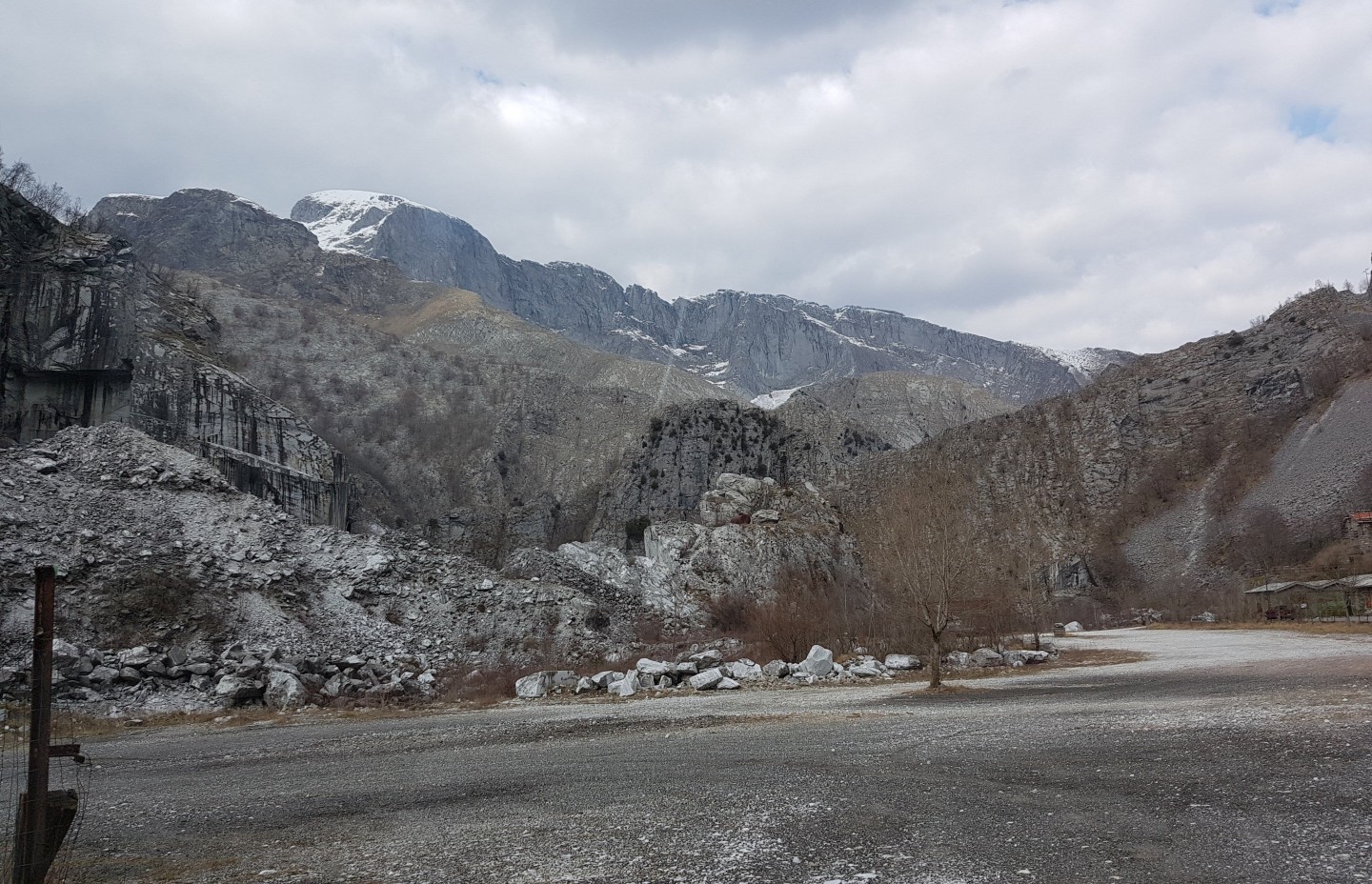Rocky landscape with mountains in the background.