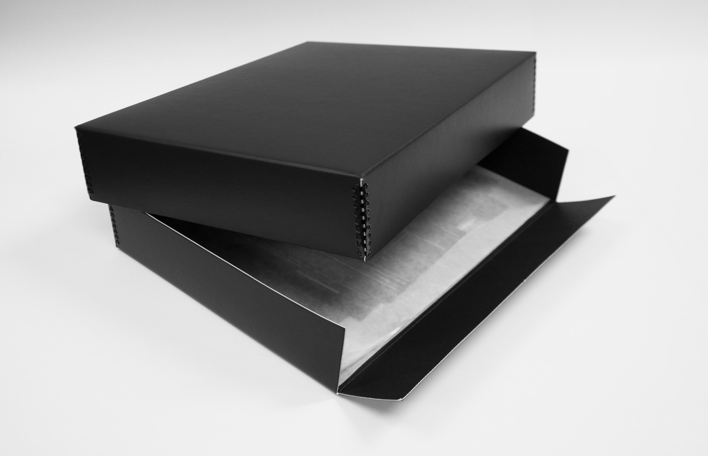 An open black box that contains documents.