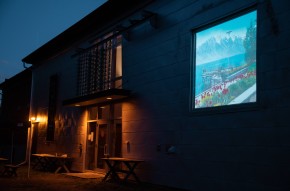Video back projection presented in a window of the La Filature building.